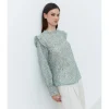 BLUSA ESTAMPADA VOLANTE